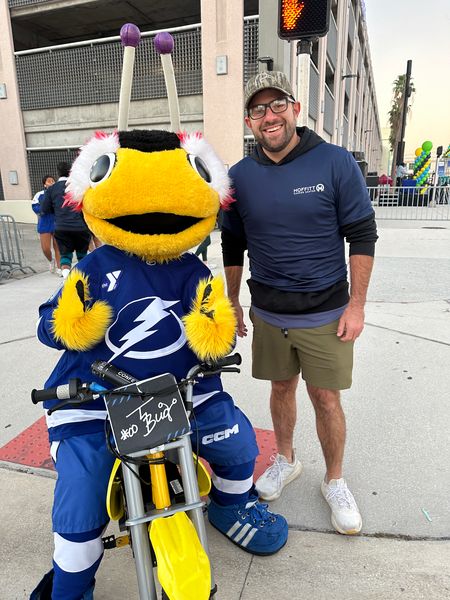 Commissioner Vince Nowicki with the Tampa Bay Lightning mascot at Miles for Moffitt